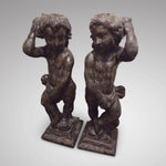 Pair of carved oak cherubs
